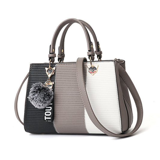 Women’s Patchwork Handbag with Hairball Ornament – Elegant Tote & Crossbody Shoulder Bag for Parties LONDYN UPBRINGING